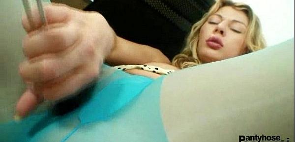  Blonde Vanesa masturbates through her blue nylons in kitchen
